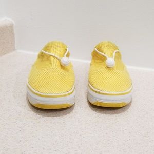 Madness women's yellow and white slip on sneakers